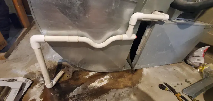 Air handler drain pan overflowing with condensate in a Duluth attic